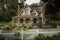 gabled roof house with fence and trellis wrap-around porch