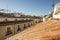 Gabled roofs and roofs with clay tiles and antennas and chimneys, terraces with gazebos and dormer windows