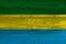 Gabon flag painted on old wood plank