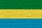 Gabon flag painted on old wood plank