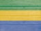 Gabon flag painted on wood plank background. Wooden texture flag of Gabon