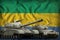 Gabon tank forces concept on the national flag background. 3d Illustration