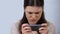 Gadget addicted woman playing video game on smartphone, modern technology