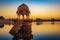 Gadi Sagar Gadisar lake Jaisalmer Rajasthan with ancient architecture at sunrise.