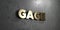 Gage - Gold sign mounted on glossy marble wall - 3D rendered royalty free stock illustration