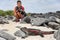 Galapagos Christmas Iguana and tourist wildlife photographer taking picture