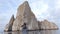 Galapagos Cruise ship tourist on boat looking at Kicker Rock nature landscape