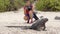 Galapagos Islands - Christmas Iguana and tourist wildlife photographer