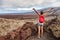 Galapagos tourist hiking on Santiago island, Ecuador, South America.