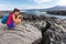 Galapagos tourist photographer taking photos of Marine Iguanas on Fernandina