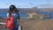 Galapagos tourist taking photos enjoying famous inconic view on Bartolome Island