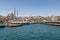 Galata bridge and the cityscape of Istanbul including the Suleymaniye Mosque captured from a port