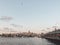 The Galata Bridge and the Galata Tower on the Bosphorus in Istanbul, Turkey. Istanbul views with many seagulls and cloudy sky.