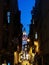 Galata Tower at night through buildings. Istanbul, Turkey.