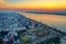 Galati, ROMANIA - March 19, 2021: Aerial view of Galati City, Romania. Danube River near city with sunrise warm light