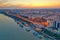 Galati, ROMANIA - March 19, 2021: Aerial view of Galati City, Romania. Danube River near city with sunset warm light