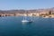 Galaxidi Greece. Sailboat anchored, traditional waterfront houses background