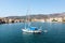 Galaxidi Greece. Sailboat anchored, traditional waterfront houses background