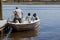 A Galaxy model small open motorboat with three passengers is setting up for a small trip in Nanticoke river.