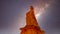 Galaxy in the night sky over the natural statue of Queen Victoria created by erosion of a Sandstone Pinnacle in Bryce Canyon