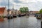 The Galgewater canal in Leiden, Netherlands, with old ships and houseboats.