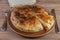 Galician empanada pie in a ceramic dish. The Spanish national dish. Close-up.