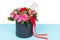 Gallant bouquet of pink and red roses with a blank gift tag with