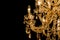 Gallant chandelier with light candles and dark side background