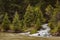 Gallatin river stream white water rapids amongst pine trees Montana, USA