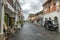 GALLE, SRI LANKA - AUGUST 21, 2019: alleyway in Old Town Galle with shops services and tuk tuk vehicle