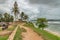 GALLE, SRI LANKA - AUGUST 21, 2019: walking path on fortifications of Old Town Galle south with Fort Lighthouse