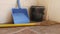 Galley Broom and Dustbin placed in a corner of home for cleaning chores