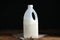 Gallon bottle of milk and napkin on wooden table
