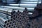 galvanized steel pipes stacked in warehouse