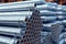 galvanized steel pipes stacked in warehouse