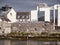 Galway city, Ireland - 10.02.2022: People enjoy view on river Corrib. Low tide. Town center