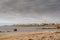 Galway city, Ireland - 10.15.2021: Salthill promenade and beach. Cloudy sky. Construction crane in the background