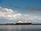 Galway / Ireland 05/19/2019 Fishing vessel Fiskibas sailing from Galway port and cruise ship Silver Cloud anchored in Galway bay