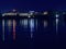 Galway, Ireland - 15.10.2021: City lights reflection in river Corrib. Night scene. Argos shop on Headford road