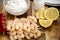 Gambas prepared for grilling on a wooden board with tomato, dip, salt and lemon