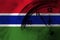 Gambia, Gambian flag with clock close to midnight in the background. Happy New Year concept