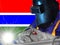 GAMBIA WELDER WITH BACKGROUND OF HIS