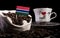 Gambian flag in a bag with coffee beans isolated on black