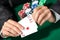 Gambler shows poker cards 4 aces