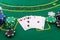 Gambling theme. Colorful casino chips on green poker table close up