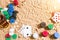 Gambling on vacation concept - white sand with seashells , colored poker chips and cards. Top view