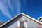 gambrel roof close-up under clear skies