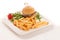 Gamburger with frenchfries on a plate isolated over white backgr