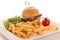 Gamburger with frenchfries on a plate isolated over white background