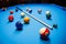 The game of American billiards. Multi-colored billiard balls on gaming table.